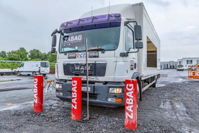 three bollards in front of a truck
