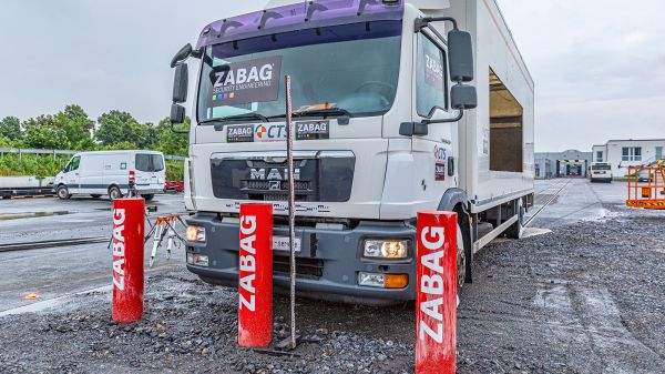 three bollards in front of a truck
